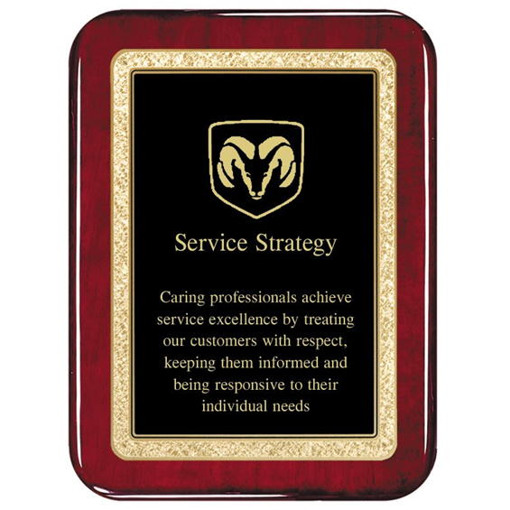 Rosewood plaque, customized engraved lettering and a design on top of them.