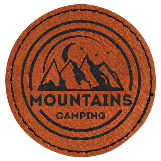 A round laserable leatherette patch that has mountains ingraved in the middle with the letters &quot;Mountains camping&quot; underrneath.